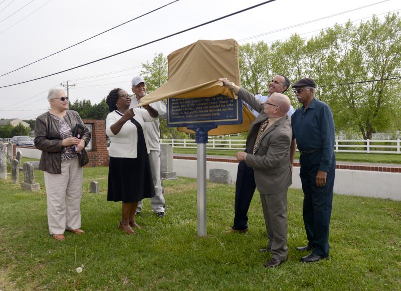 Unveiling the marker are (l-r) Sandra Neal, the Rev. Marjorie Belmont-Burns, Irving Jackson, Sen. Ernie Lopez, Stephen Marz, and Paul Selby.